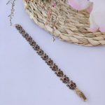 دستبند عمده مارگازیت زنانه طلاروس گل شیپوری نگین زرشکی و قیمت مناسب